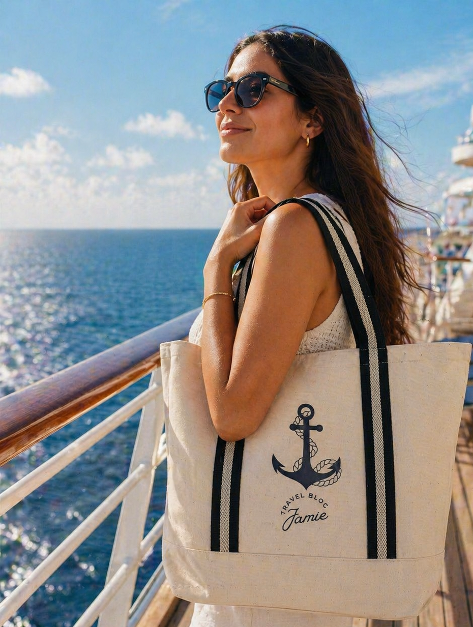 Woman on a cruise ship holding a tote bag with an anchor design.